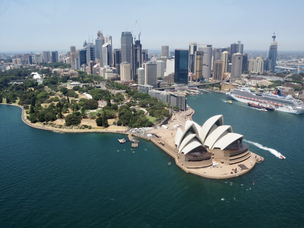 View of Sydney Opera house from the air and city skyline